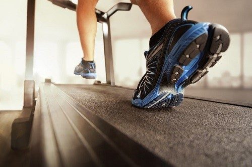 Man Running On Treadmill Overlooking Sunset